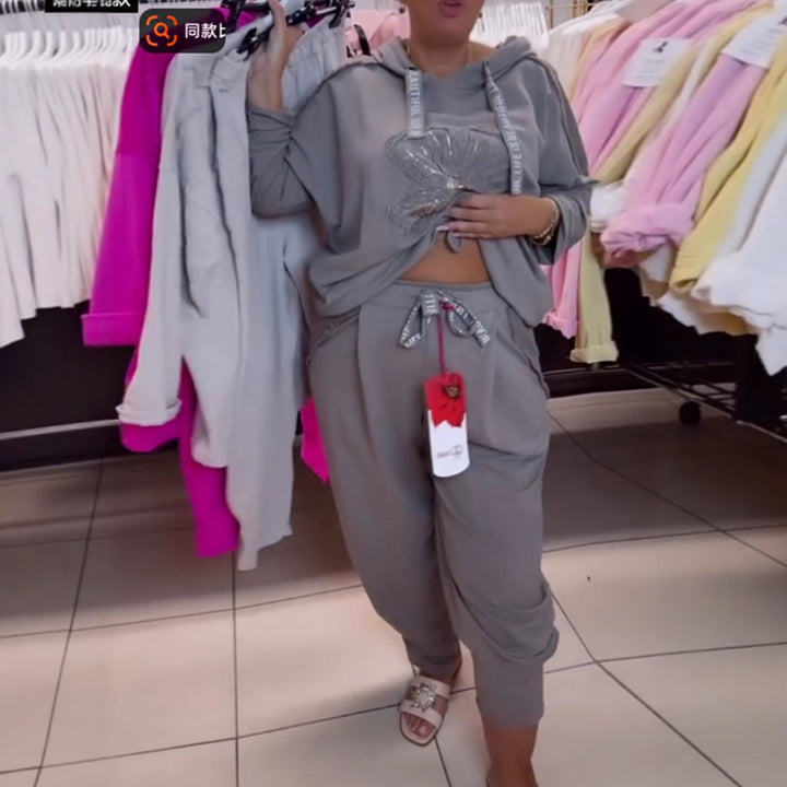 Damen nan entspanntes Lounge-Set mit Blüten-Pailletten-Hoodie, Kordelzug und weiter Bundfaltenhose Echo Archiv