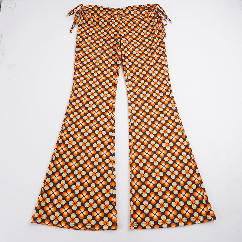 Damen nan ausgestellte Schlaghose mit hoher Taille, seitlichen Kordelzügen und retro Blumenprint Echo Archiv