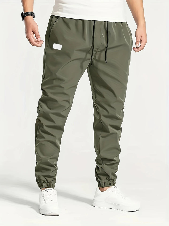 Herren Technische Jogginghose im Tapered‑Utility‑Stil mit elastischem Bund & Knöchelbündchen Echo Archiv