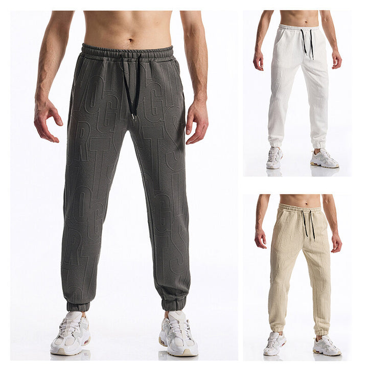 Herren Jogginghose mit elastischem Bund, Tunnelzug und geprägtem Allover‑Logo‑Relief Echo Archiv