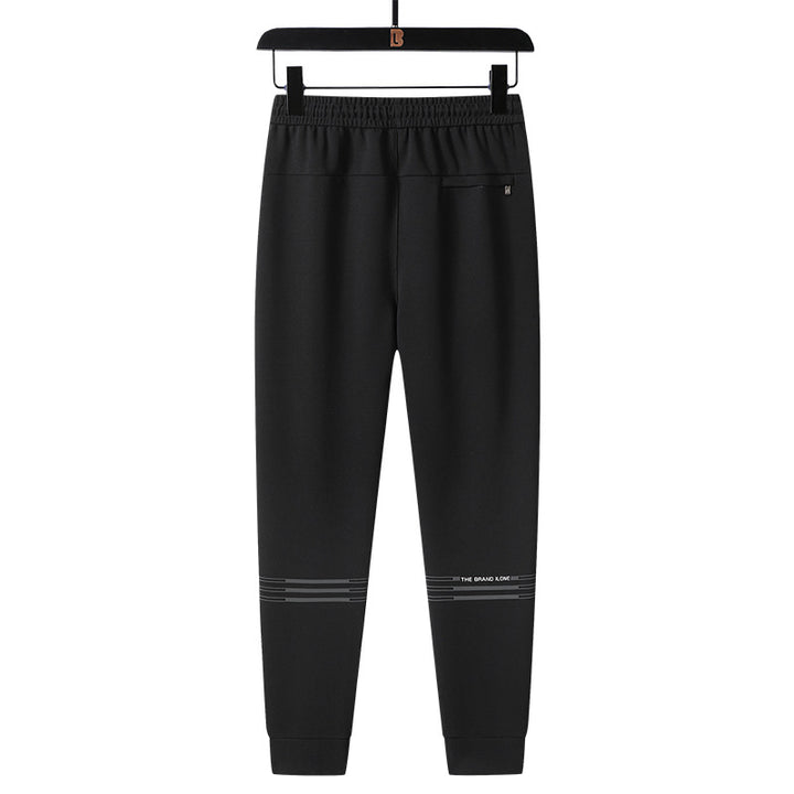 Herren Sportliche konisch zulaufende Jogginghose mit Elastbund, Kordelzug & Reißverschlusstaschen Echoarchiv
