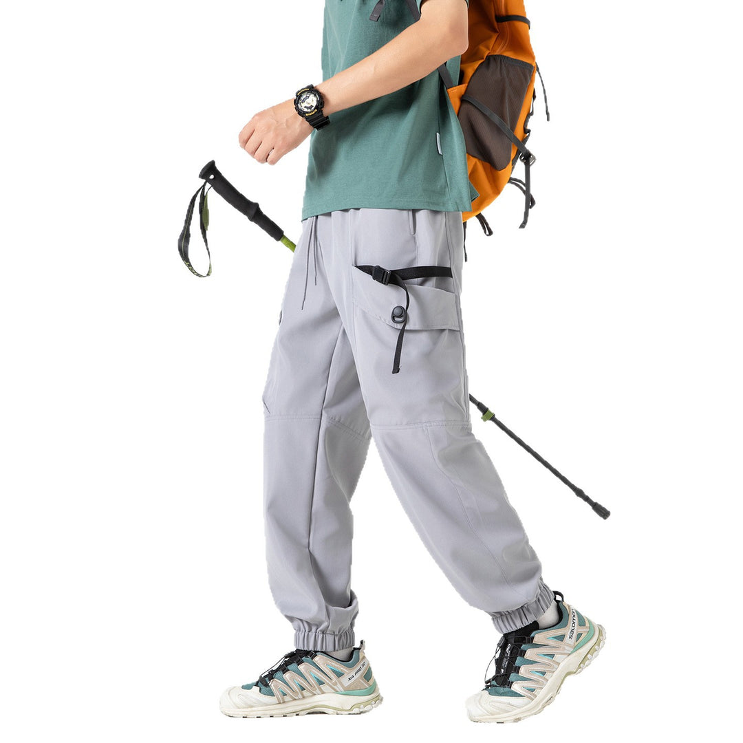 Unisex Weite Technical-Cargo-Jogginghose mit verstellbarem Tunnelzug, großen Klapptaschen und elastischem Knöchelabschluss Echo Archiv
