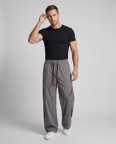 Herren Extra Breite Nylon Jogginghosen im Baggy-Schnitt mit Kordelzug, dekorativen Paneelen und seitlichen Kontraststreifen Echoarchiv