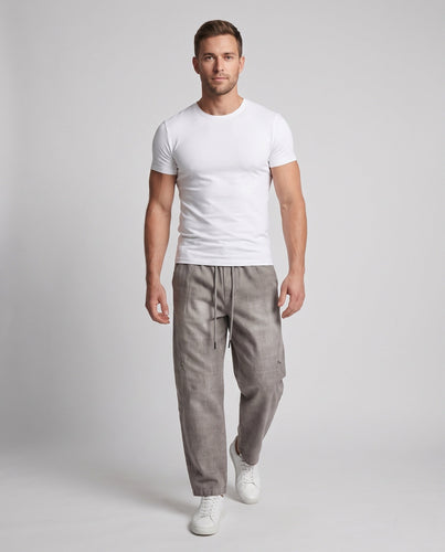 Herren Weite Baggy-Freizeithose mit Tunnelzug, washed Denim‑Optik und Utility‑Nähten Echoarchiv