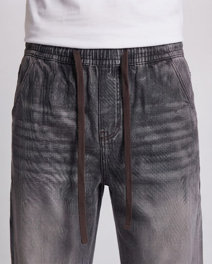 Herren weite Stonewash-Denimhose mit Kordelzug und Kontrastnähten Echo Archiv
