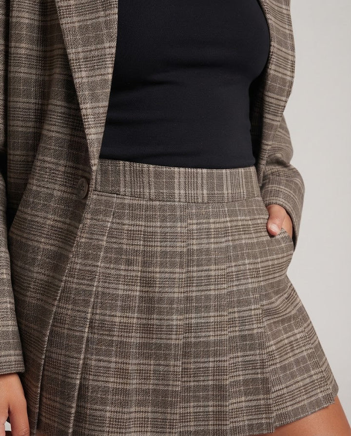 Damen Zweiteiliges Glencheck-Blazer- und Plissee-Minirock-Set mit Oversize-Schulter Echo Archiv