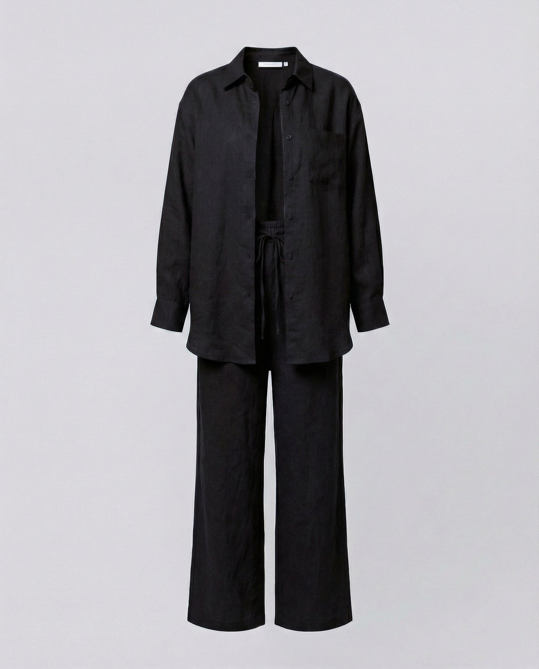 Damen Lässiges Leinen-Outfit mit weit geschnittenem Hemd und lockeren Hosen Echoarchiv